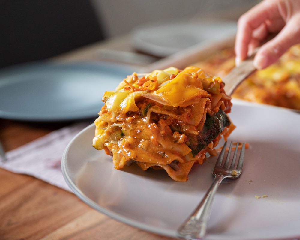 Photo of a slice of cooked lasagna.